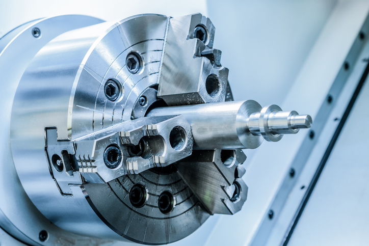 metal workpiece clamped in the lathe chuck CNC machine